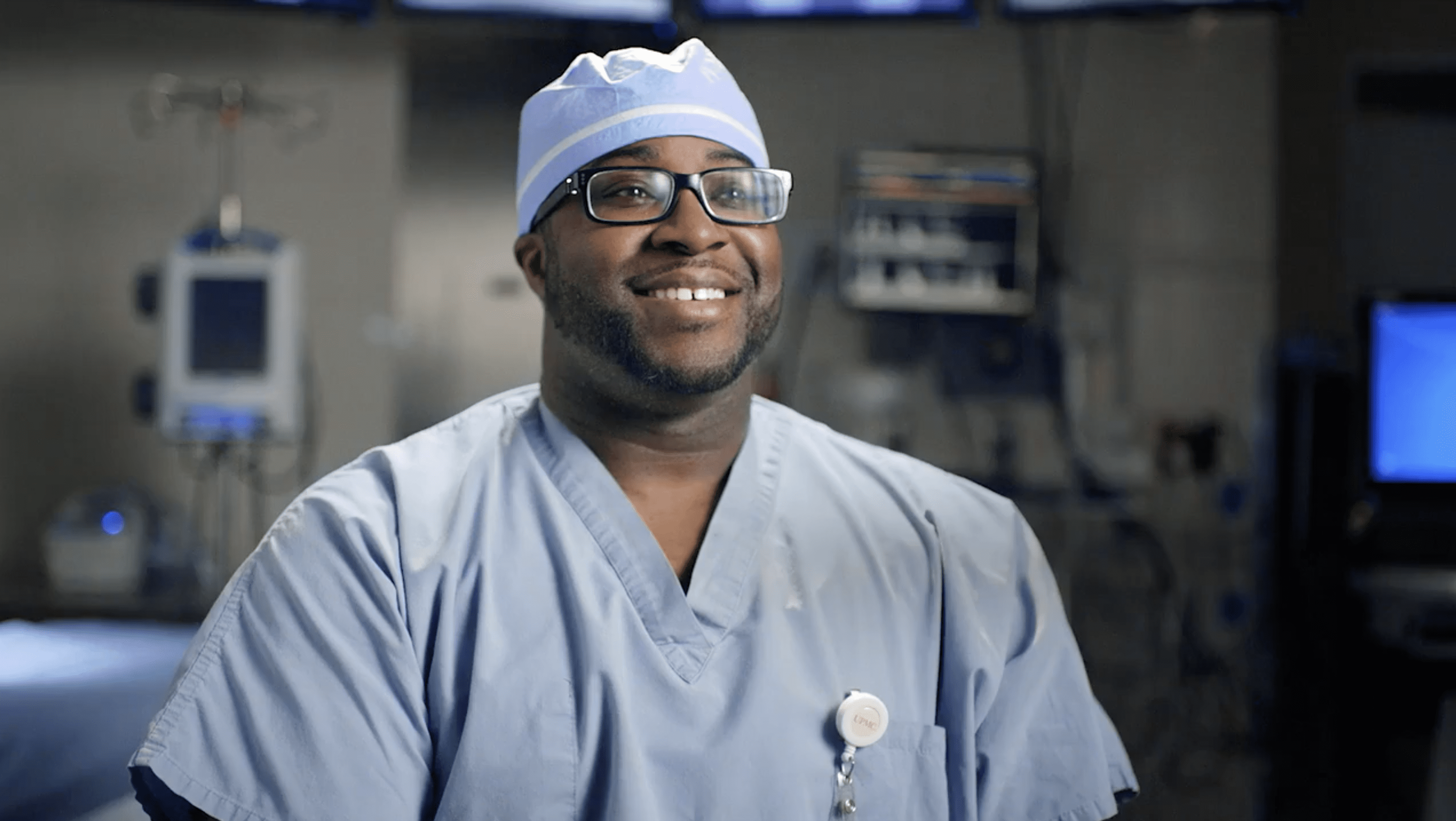 Physician in surgical hat.