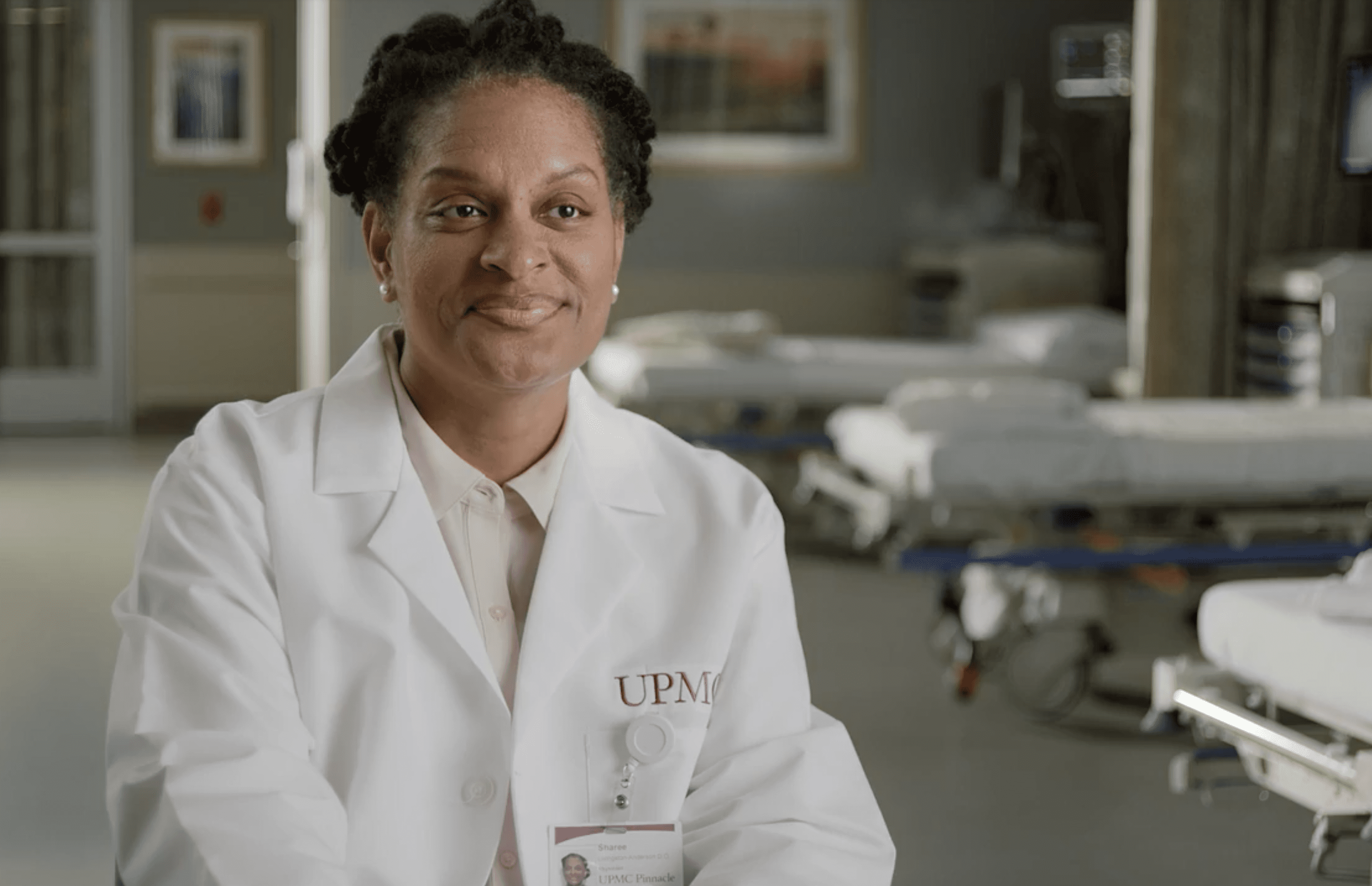 Female physician in white coat. 